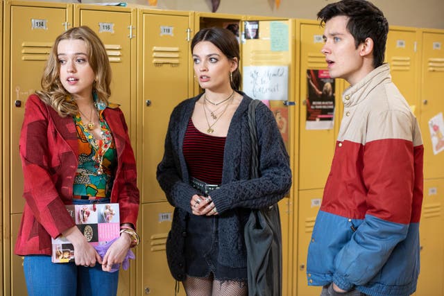 Sex Education's Aimee (Aimee Lou Wood), Maeve (Emma Mackey) and Otis (Asa Butterfield) in the corridors of Moordale High