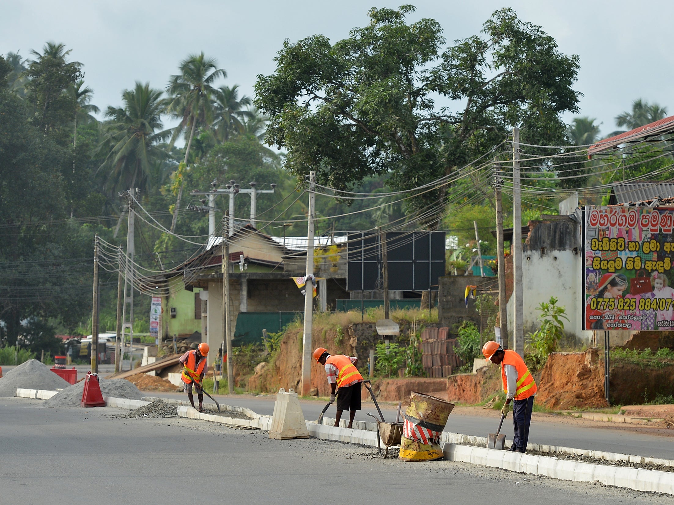 Constructors work on China's expensive intercontinental 'belt and road' construction project, Colombo Sri Lanka August 5 2018 (AFP/Getty Images)