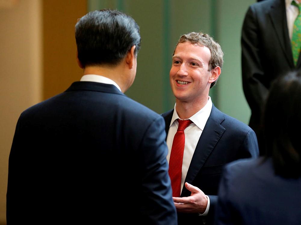 Chinese President Xi Jinping talks with Facebook CEO Mark Zuckerberg during a 2015 meeting. Facebook is currently banned in China