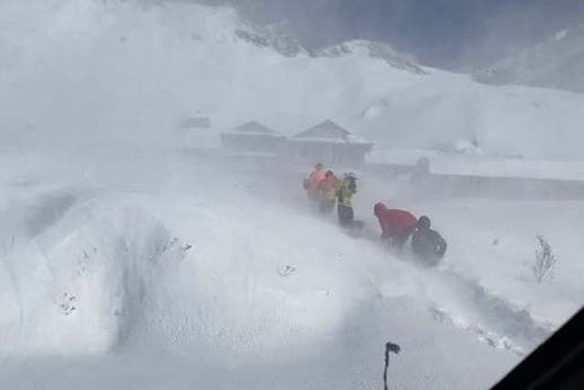 Climbers await rescue after an avalanche hit in Deurali