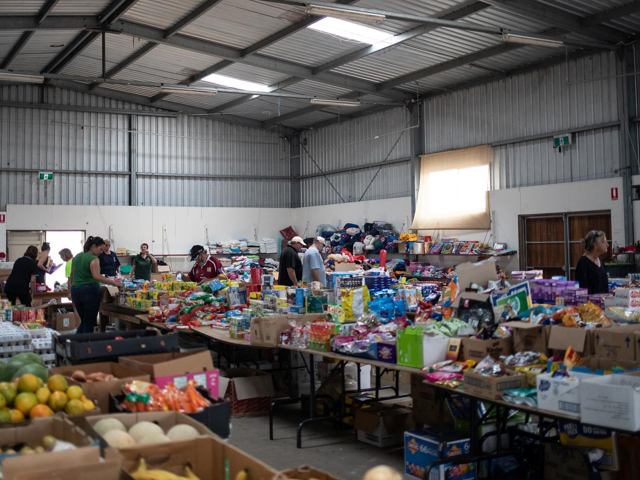 People select donated goods at an unofficial evacuation centre in Cobargo New South Wales January 12 2020 (Alkis Konstantinidis/Reuters)