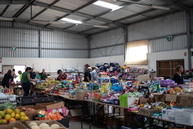 People select donated goods at a showground that was turned into an unofficial evacuation centre in Cobargo New South Wales Australia January 12 2020 Alkis Konstantinidis/
