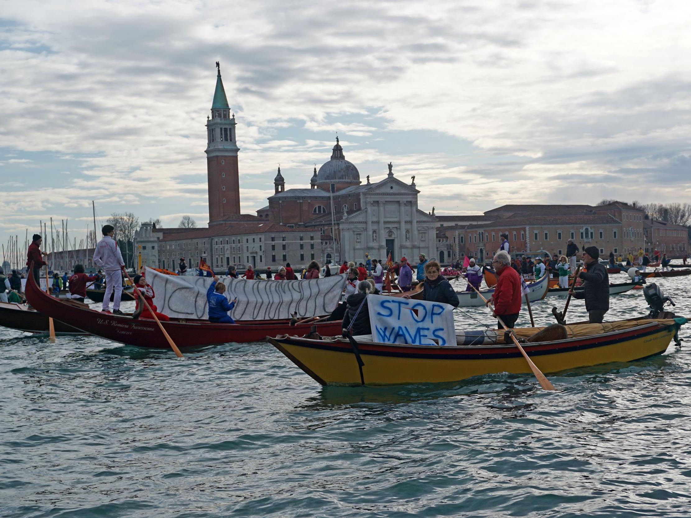 Rowing and sailing boats sail along the St Mark’s basin as Venetians protest against the damage caused by waves created by large motorboats