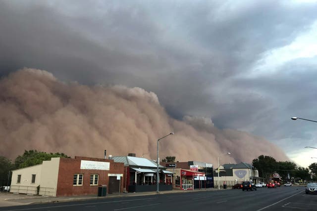 A dust cloud billows over a street in Dubbo, Australia, 400 kms (248 miles) west of Sydney