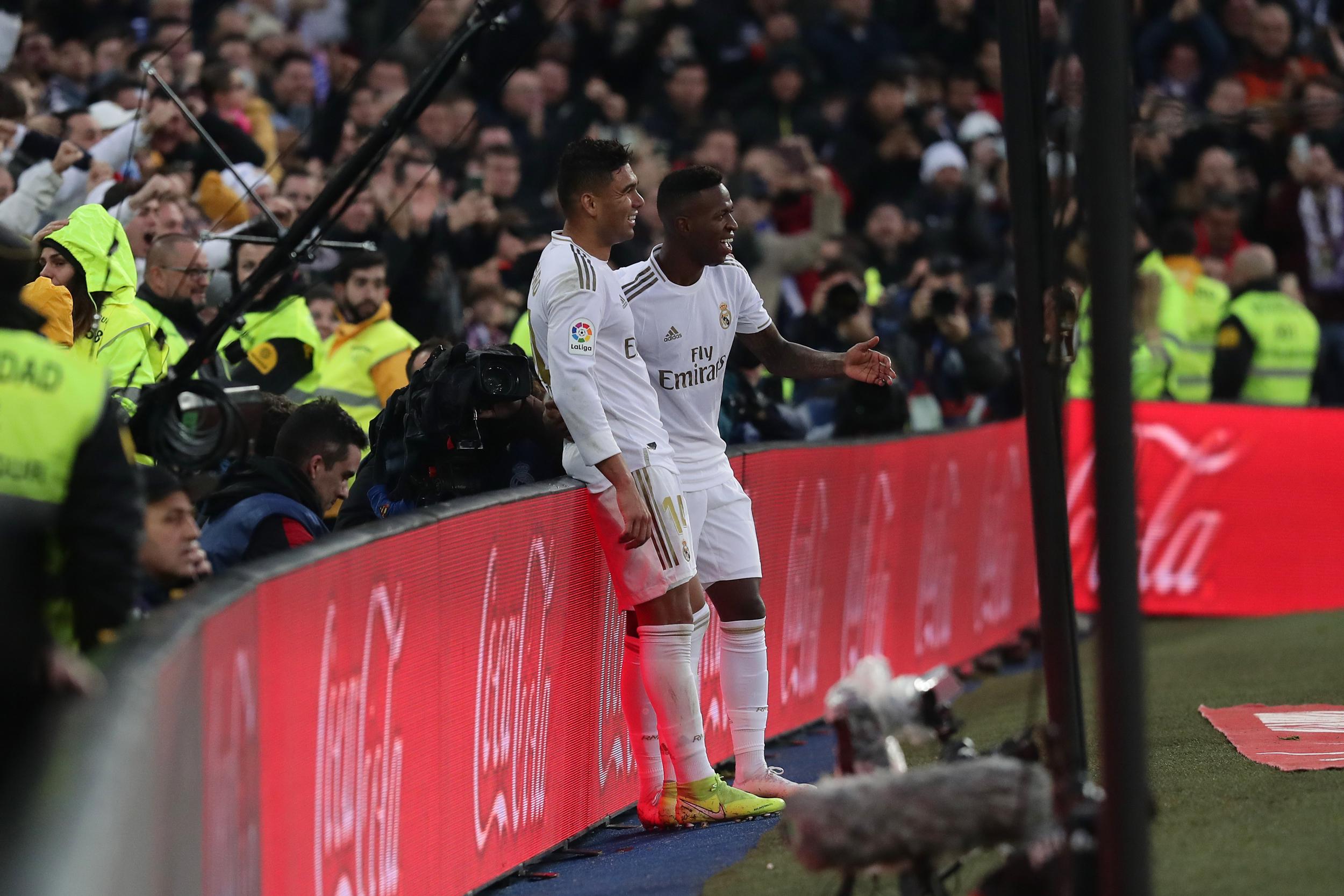 Casemiro celebrates with team-mate Vinicius Jr.