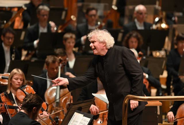 Simon Rattle of the LSO conducts at the Barbican in London