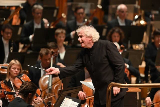Simon Rattle of the LSO conducts at the Barbican in London