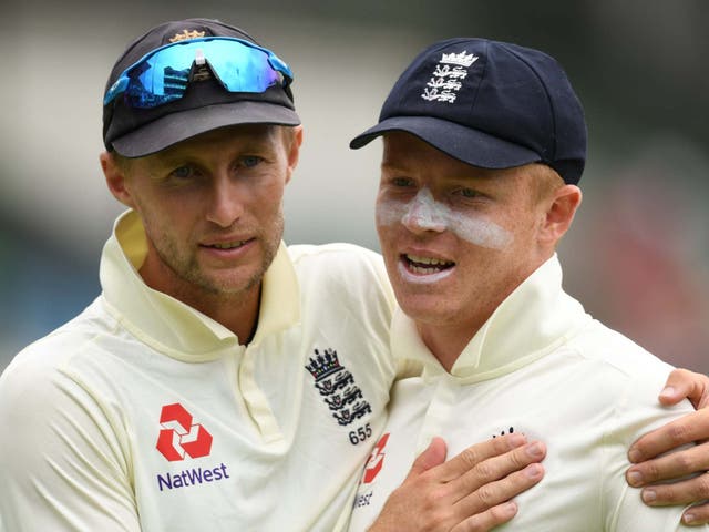Ollie Pope is congratulated by England captain Joe Root
