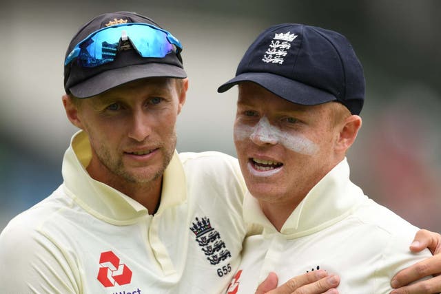 Ollie Pope is congratulated by England captain Joe Root