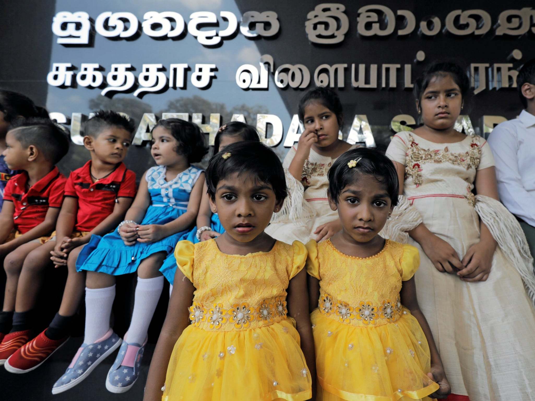 Twins pose for photographs during an event to attempt to break the world record for the biggest gathering of twins in Colombo, Sri Lanka January 20, 2020