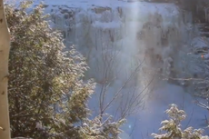 Waterfall freezes over to create mesmerising ‘diamond dust’ phenomenon