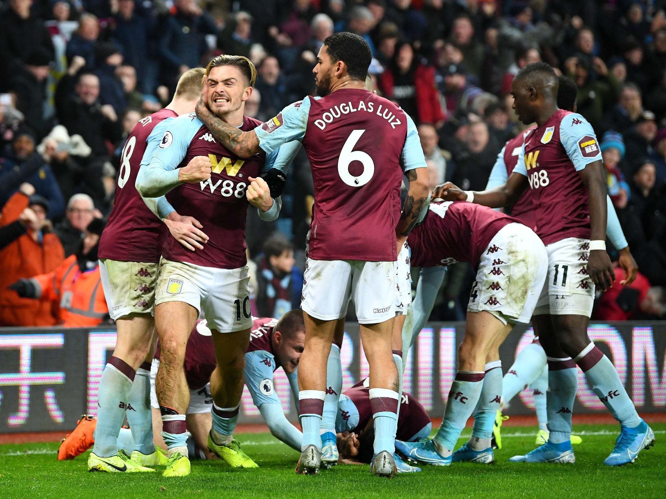 Aston Villa celebrate scoring a late winner against Watford