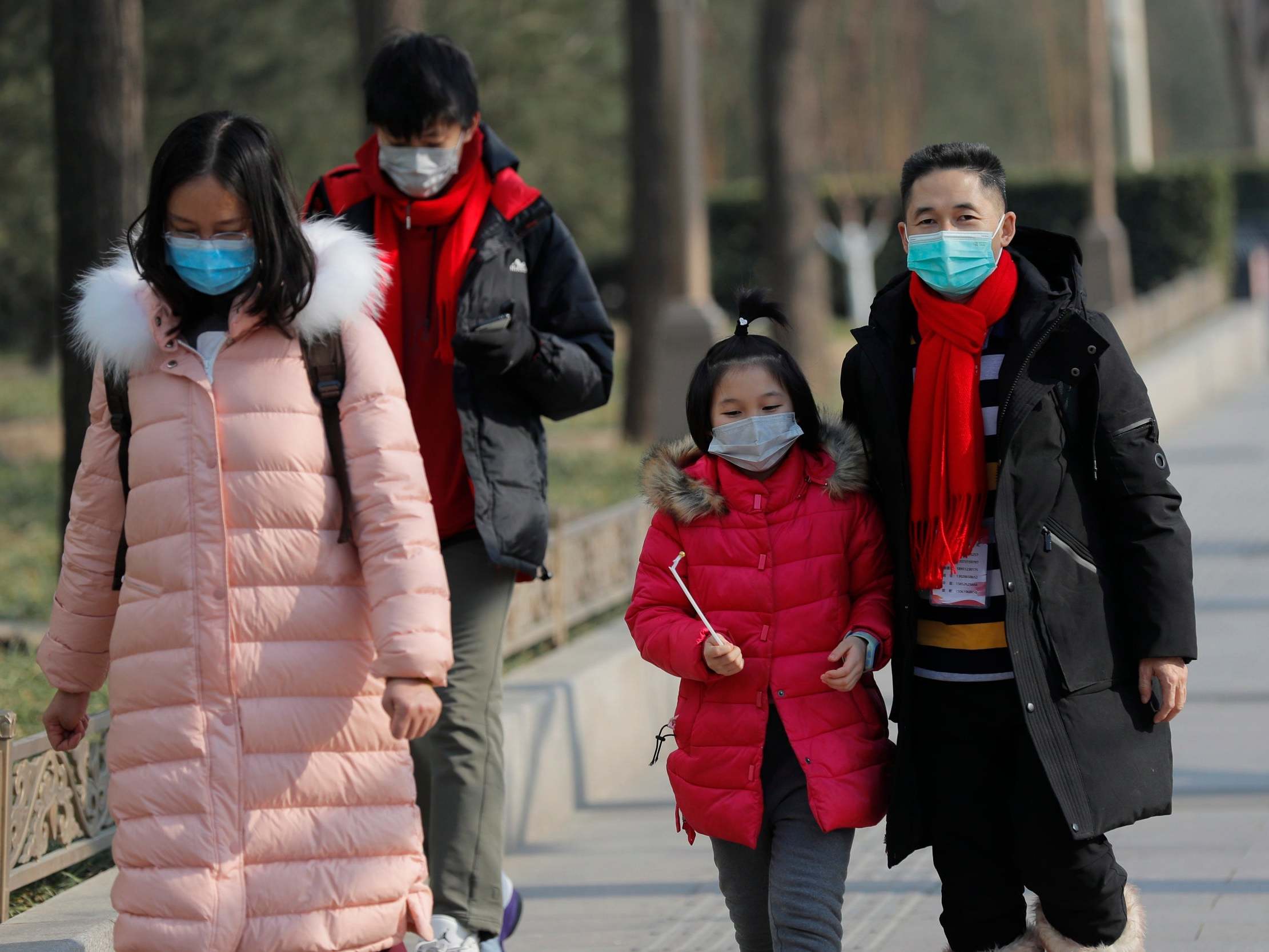 Chinese health officials say virus could mutate and spread further as they warn: 'Don't go to Wuhan, don't leave Wuhan'