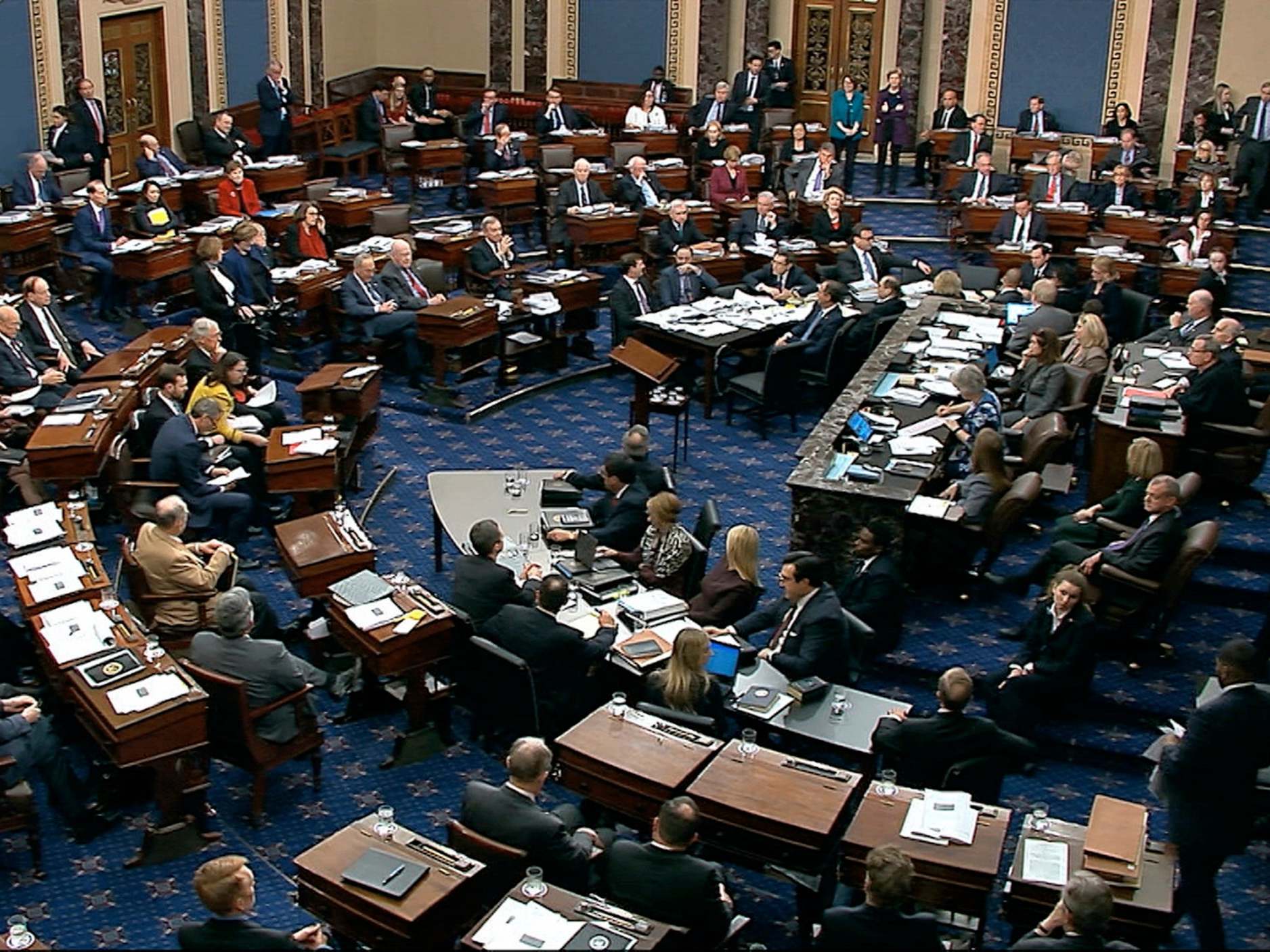 Senators vote on approving the rules for the impeachment trial
