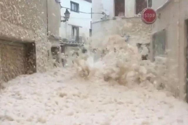 The Spanish town of Tossa del Mar has been inundated with sea foam amid a deadly storm