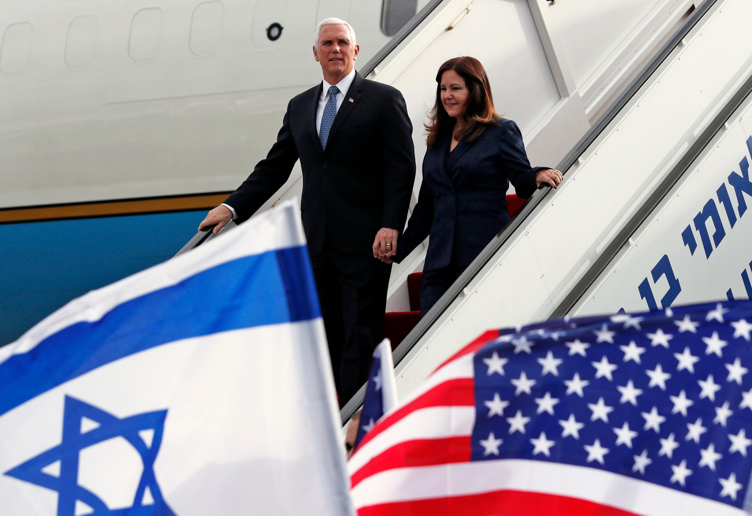 US Vice President Mike Pence (L) and his wife Karen disembark from a plane upon their arrival at Ben Gurion International Airport to attend the World Holocaust memorial