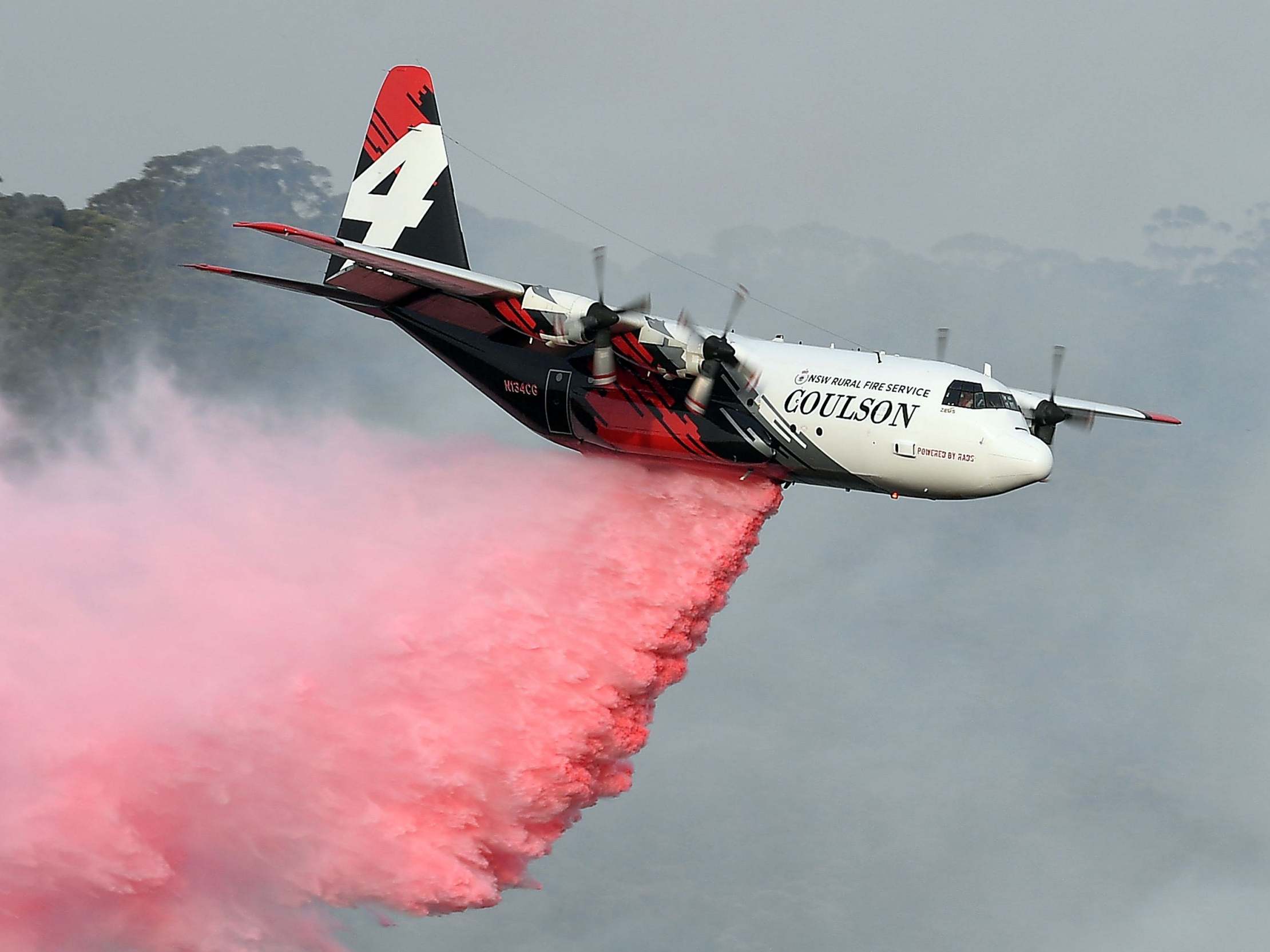 The C-130 Hercules which crashed, seen dropping fire retardant