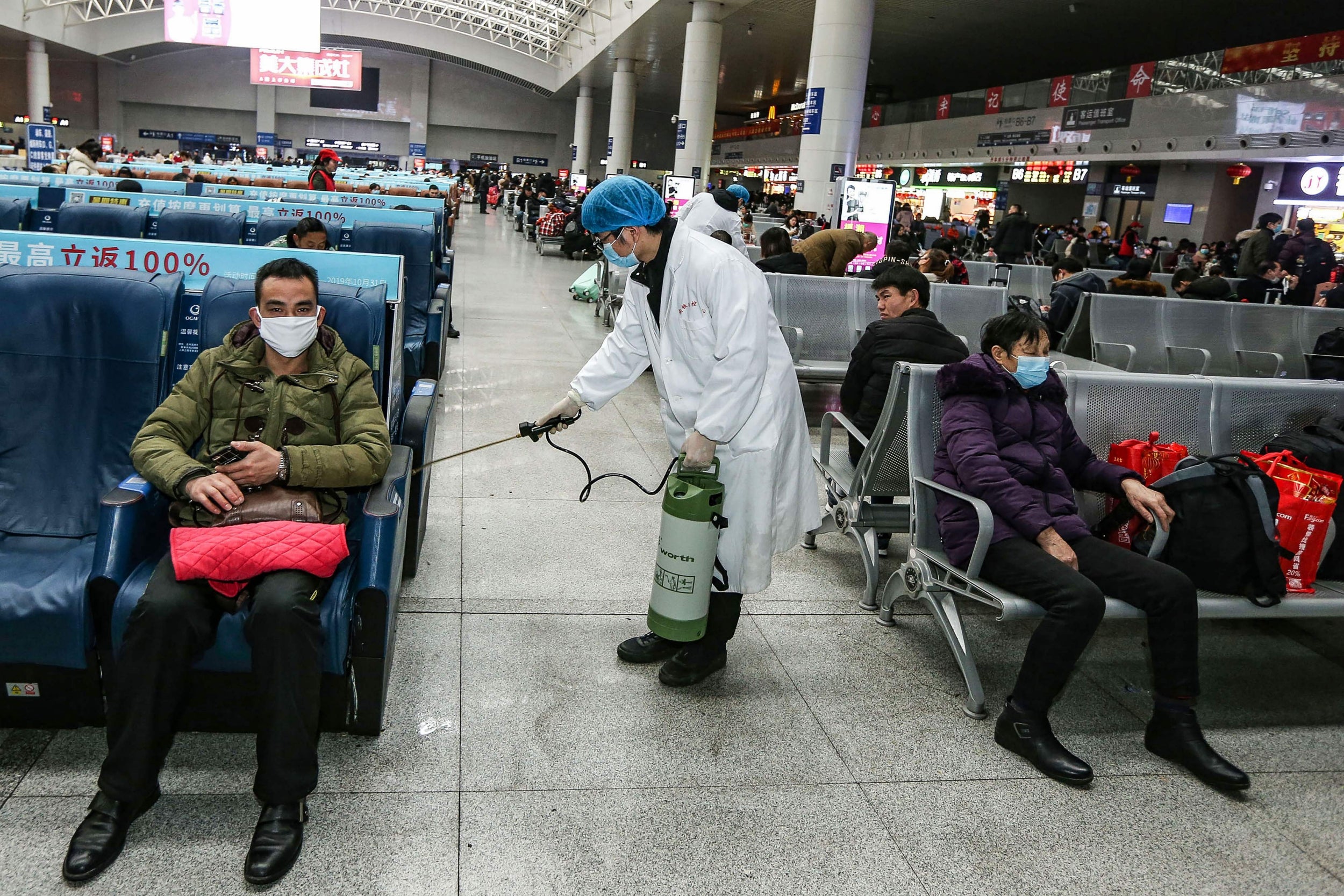 Staff disinfecting Yingtan North Railway Station, China