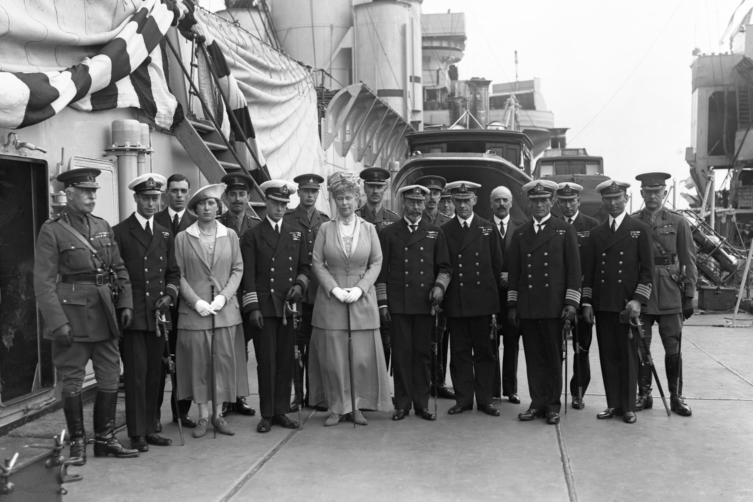 The royal party, photographed with officers of HMS Renown (PA)