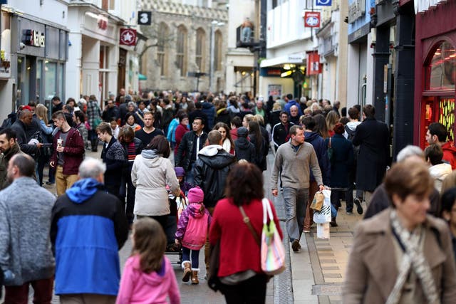 Christmas shoppers in Cambridge tempted out by big discounts being offered by retailers