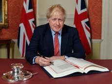 Boris Johnson signs withdrawal agreement to take UK out of EU