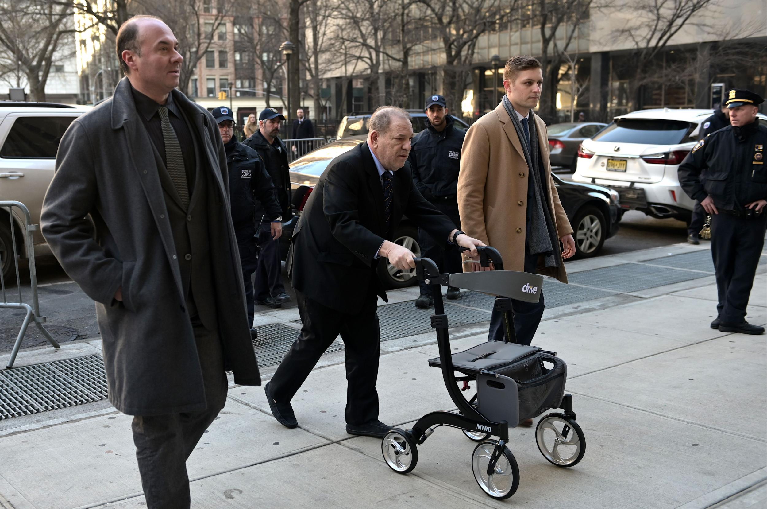 Harvey Weinstein (centre) arrives for the continuation of his trial on 24 January, 2020 in New York City.