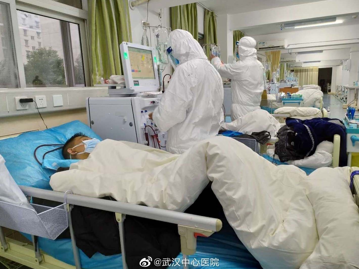 Picture uploaded to social media on January 25, 2020 by the Central Hospital of Wuhan shows medical staff attending to patients