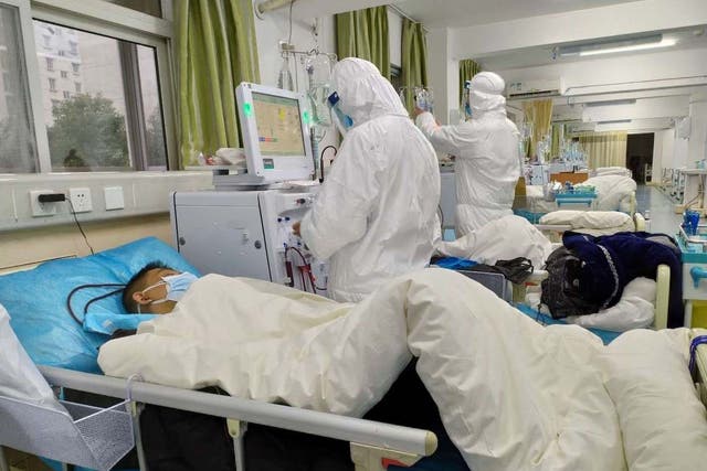Picture uploaded to social media on January 25, 2020 by the Central Hospital of Wuhan shows medical staff attending to patients