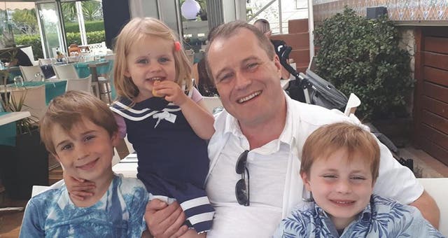 Conor McGinley, 9, Darragh McGinley, 7, and Carla McGinley, 3, with their father Andrew McGinley