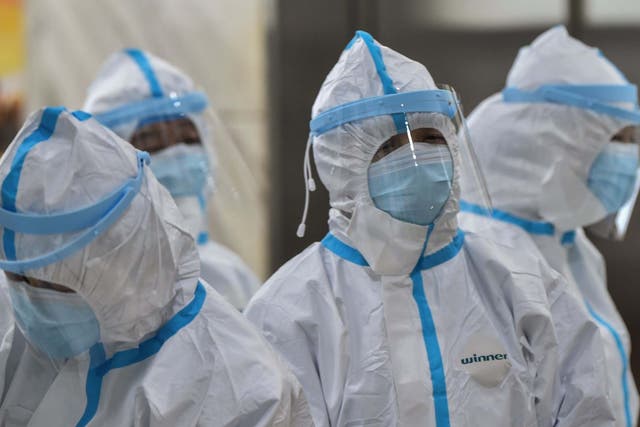 Medical staff members wearing protective clothing to help stop the spread of a deadly virus
