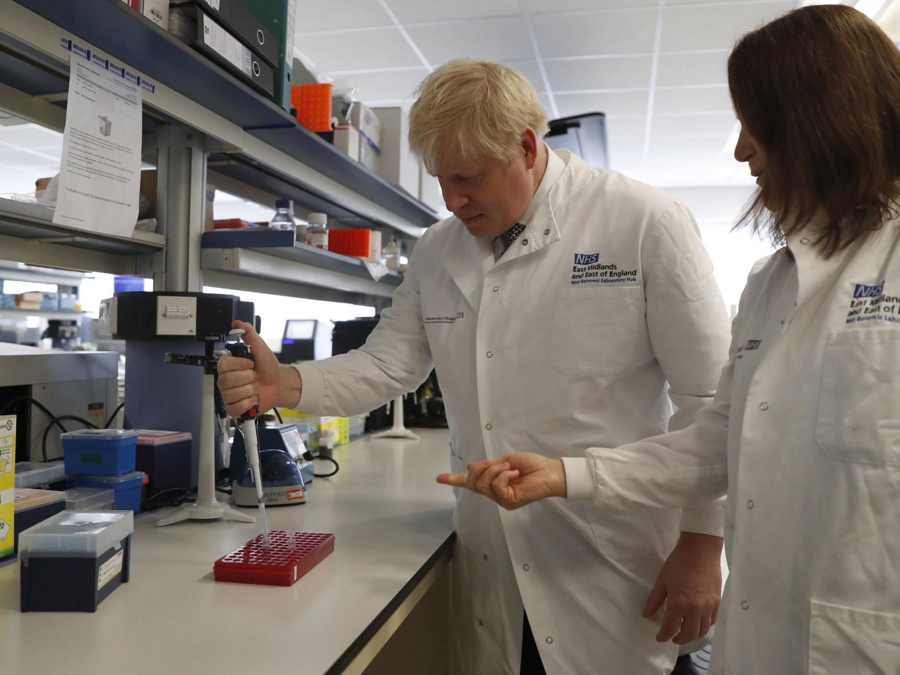 Boris Johnson speaks to Dr Sarah Bowdin during a visit to the National Institute for Health Research at the Cambridge Clinical Research Facility, in Addenbrooke's Hospital in Cambridge