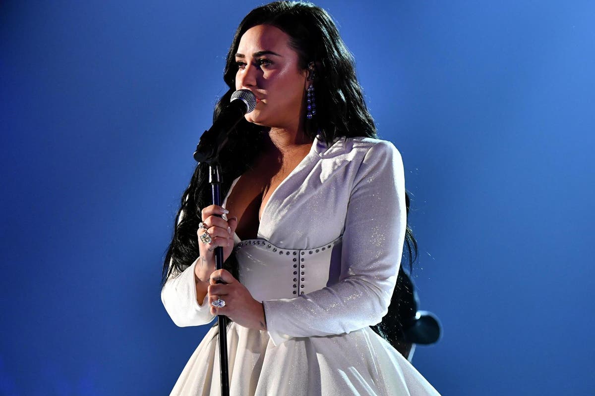 Demi Lovato earns standing ovation at Grammys with 'cry for help' song Anyone she wrote before near-fatal overdose