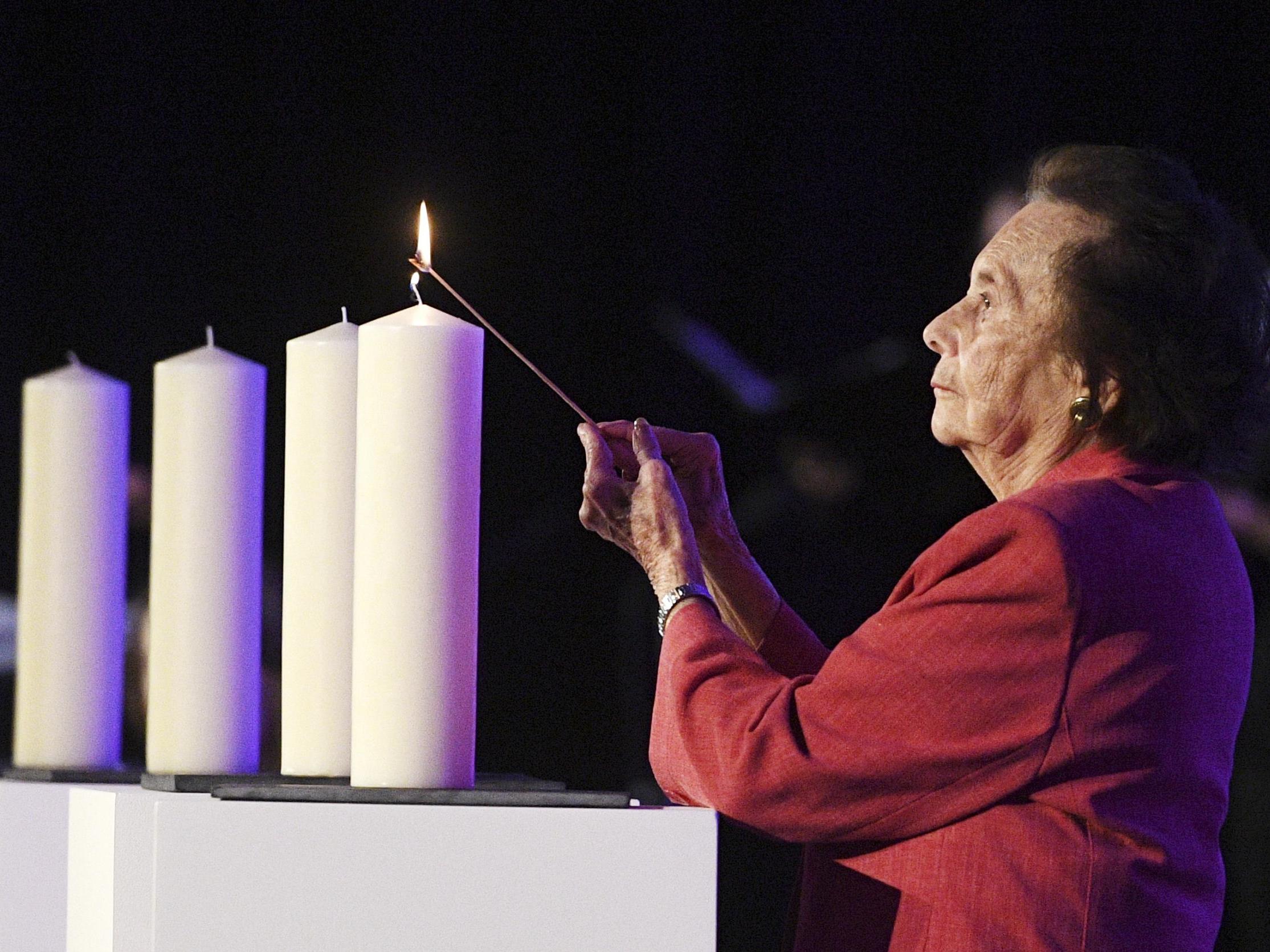 Holocaust survivor Lily Ebert lights a candle at a National Holocaust Memorial Day event in London 2017