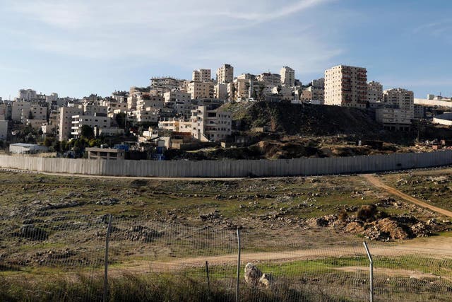 Israel's controversial separation wall in front of the Palestinian Shuafat refugee camp in the Israeli-annexed eastern sector of Jerusalem