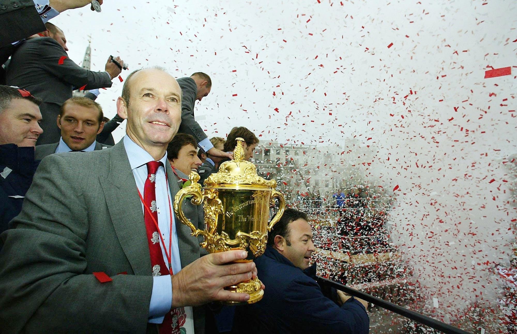 England coach Clive Woodward holds the Webb Ellis Cup during the 2003 Rugby World Cup team’s victory parade in Trafalagar Square