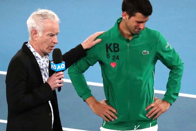 Novak Djokovic reacts as he is interviewed by John McEnroe about the death of his friend Kobe Bryant