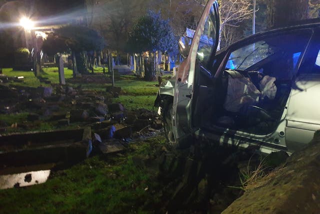 Police say driver in graveyard crash 'lucky' to have survived