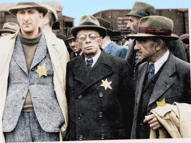 Jewish captives arrive at Auschwitz-Birkenau wearing the Star David