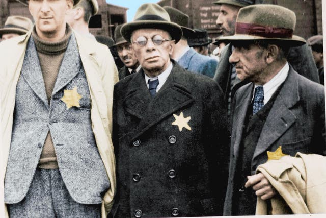Jewish captives arrive at Auschwitz-Birkenau wearing the Star David