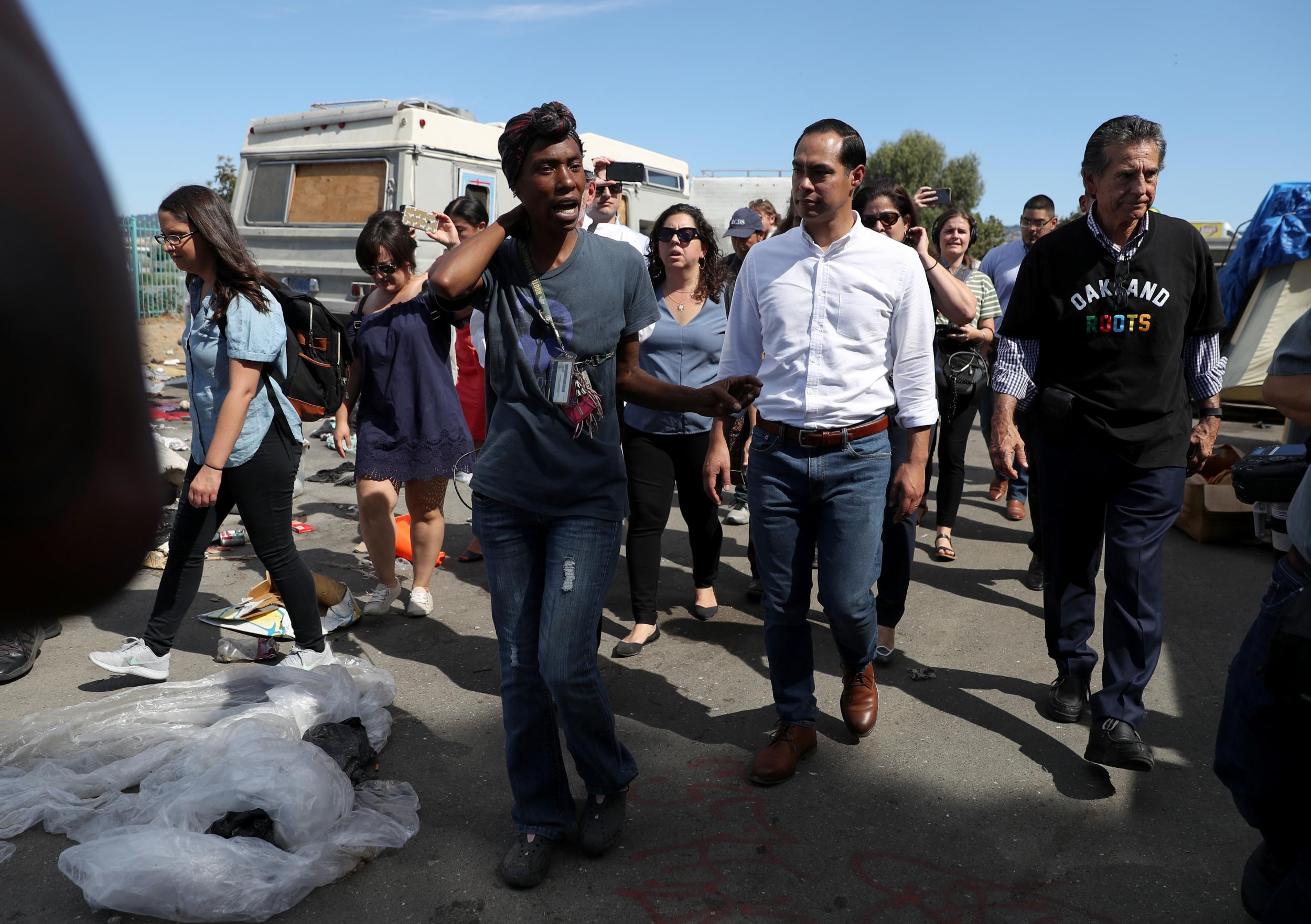 Former presidential candidate Julian Castro toured an Oakland homeless encampment that officials plan to remove.