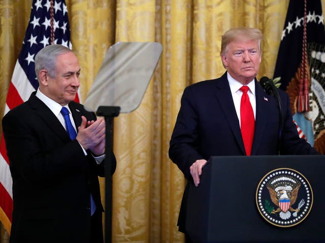 Donald Trump, alongside Benjamin Netanyahu, announces his peace deal in Washington yesterday