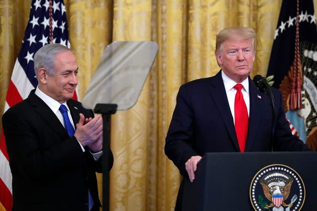 Donald Trump, alongside Benjamin Netanyahu, announces his peace deal in Washington yesterday