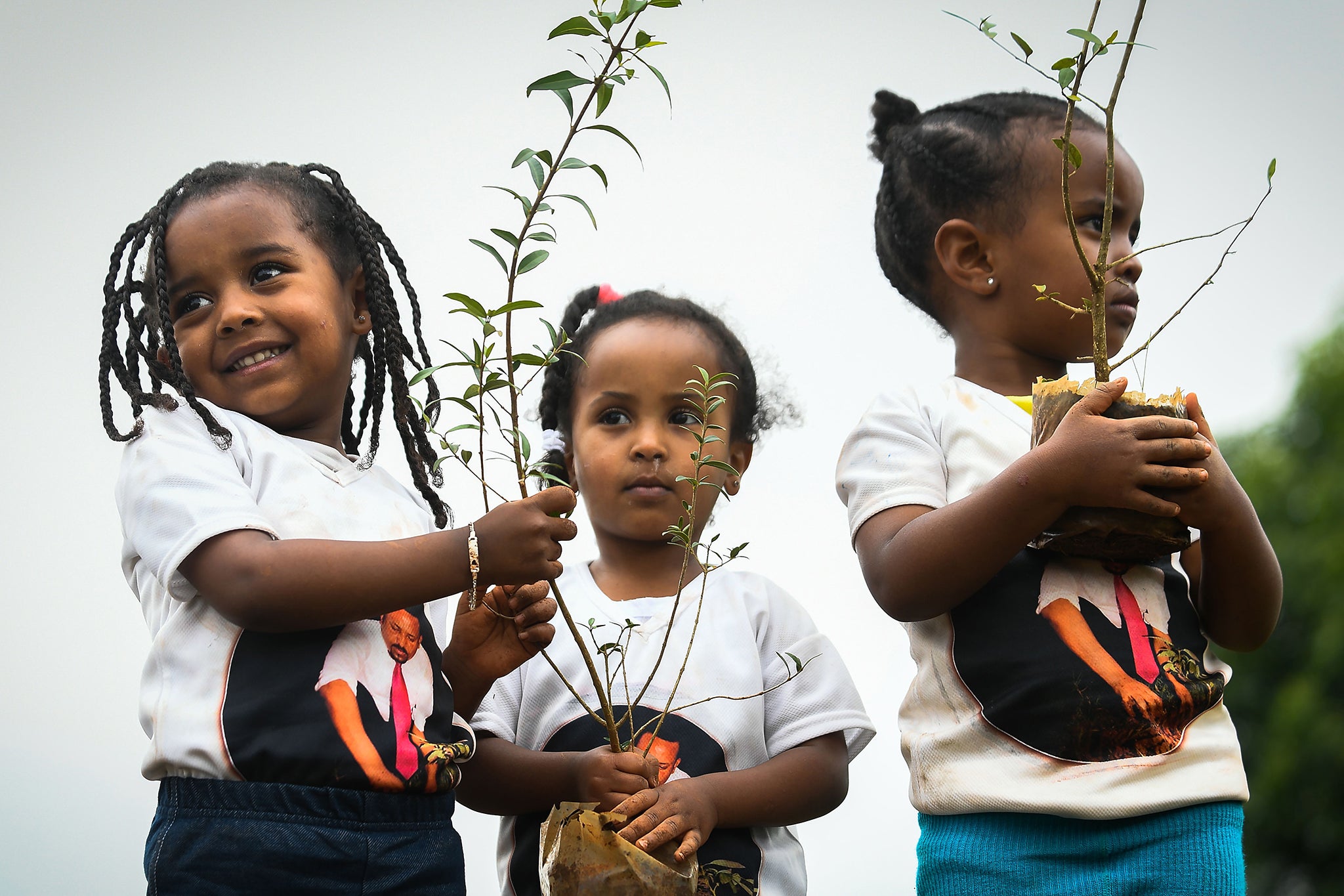 Young Ethiopian girls take part in a seed drive (AFP)