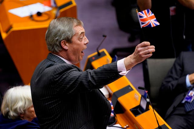 Nigel Farage waves a union flag during the European parliament plenary session