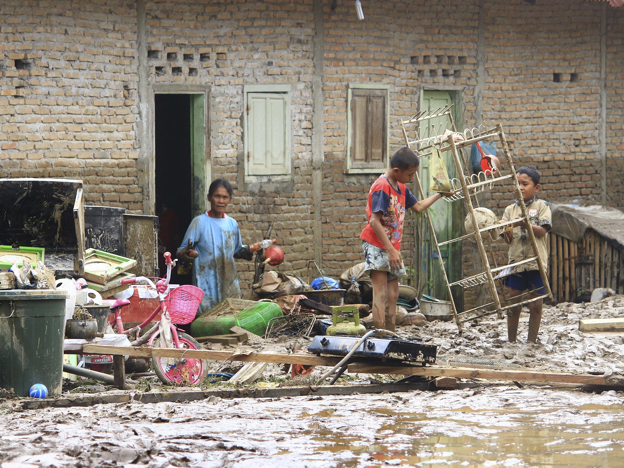 More than 2,000 people in Sumatra have been forced to leave their homes in the flooding