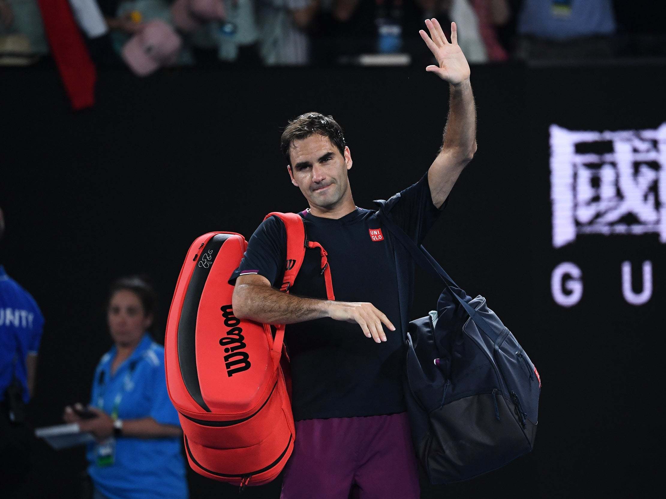 Roger Federer walks off after defeat