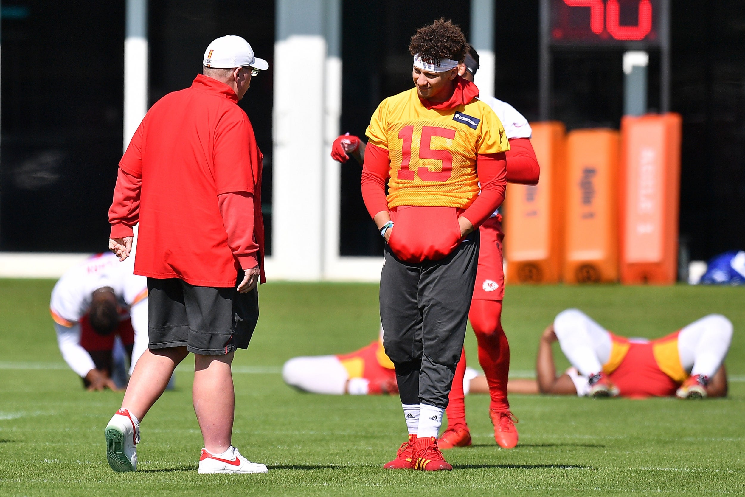 Patrick Mahomes and head coach Andy Reid chat during training (Getty)