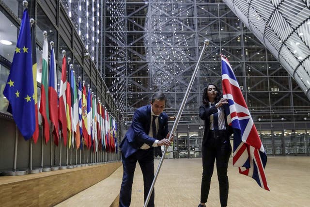 EU Council staff remove the United Kingdom's flag from the European Council building in Brussels on Brexit Day, 31 January, 2020.