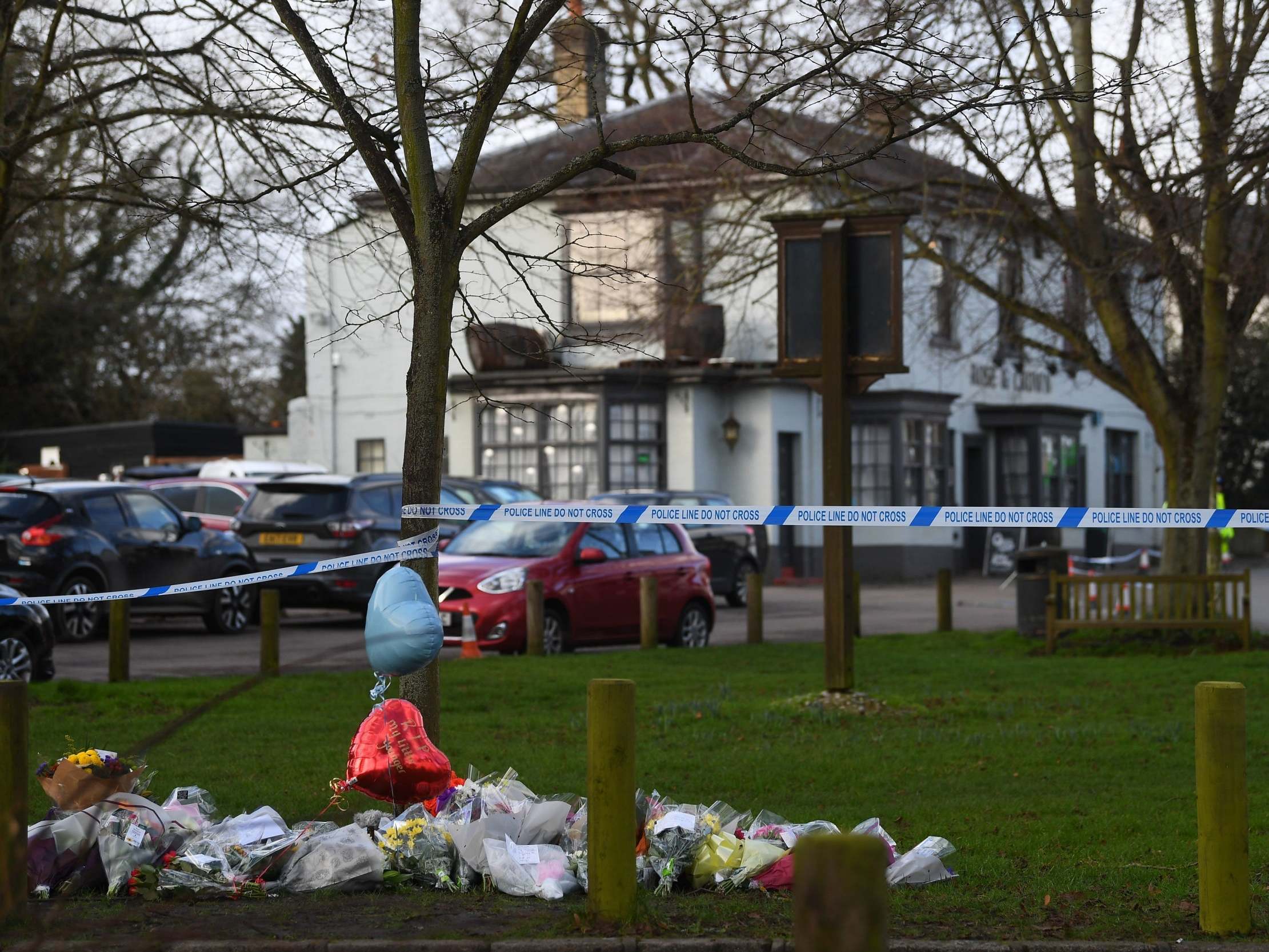 Flowers left near to the scene where a man, named locally as Liam Taylor 19, died after being stabbed outside the Rose and Crown pub in Writtle, Essex, on 31 January, 2020.