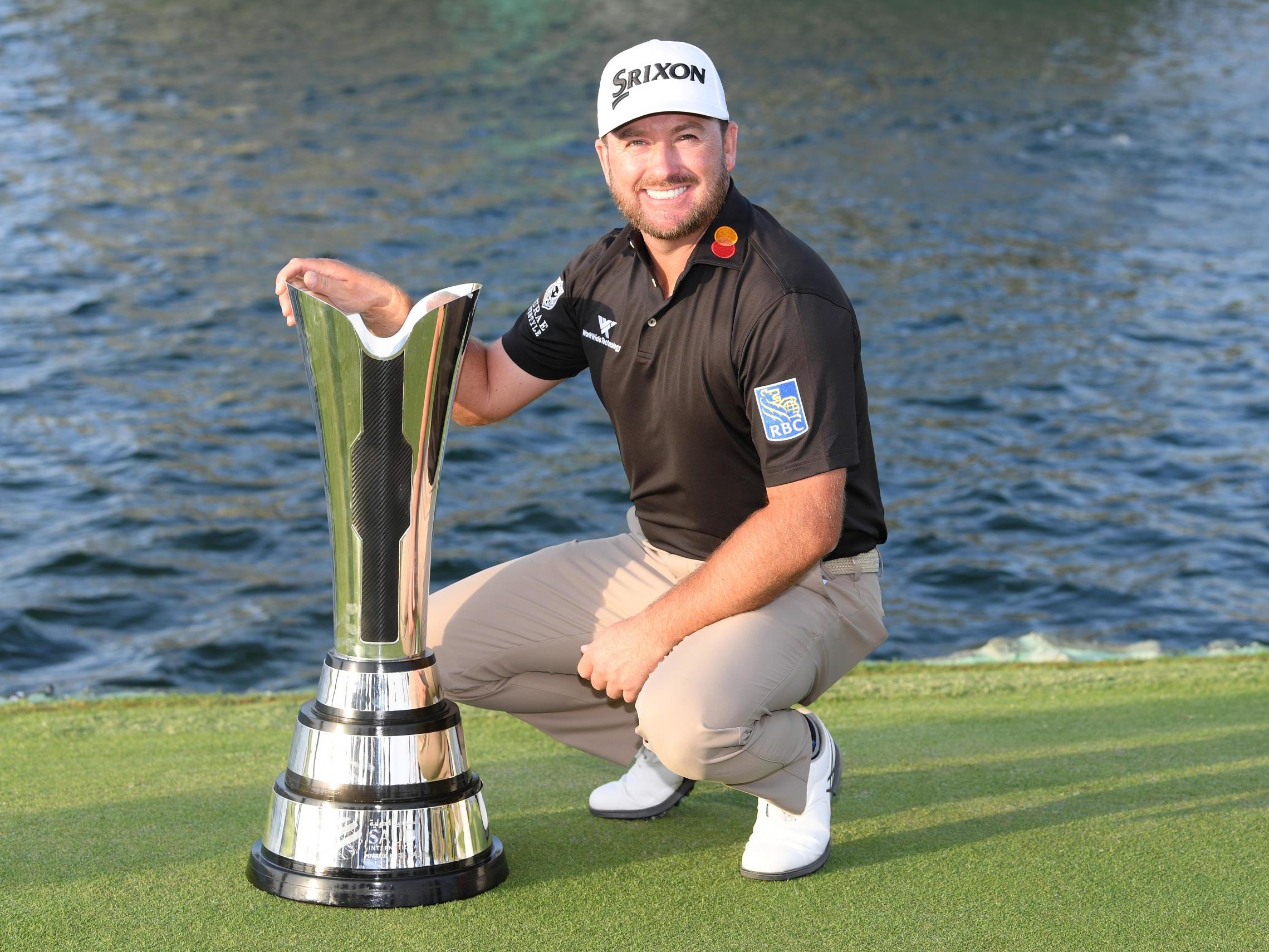 Graeme McDowell poses with the trophy at the Royal Greens Golf and Country Club
